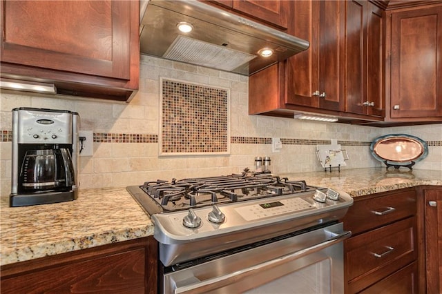 103 Old Avery Dr, Canton, GA 30115 - kitchen with exhaust hood, stainless steel gas stove, tasteful backsplash, and light stone countertops