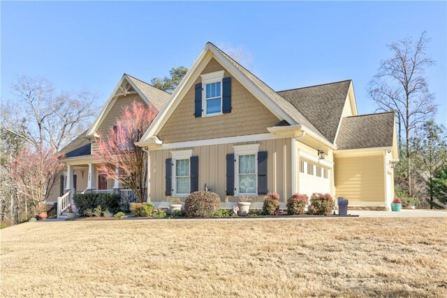 103 Old Avery Dr, Canton, GA 30115 - craftsman inspired home featuring board and batten siding, covered porch, an attached garage, roof with shingles, and a front yard