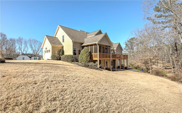 103 Old Avery Dr, Canton, GA 30115 - view of home's exterior with a garage, a sunroom, a deck, and a yard