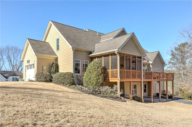 103 Old Avery Dr, Canton, GA 30115 - rear view of property with a shingled roof, a garage, a sunroom, and a yard