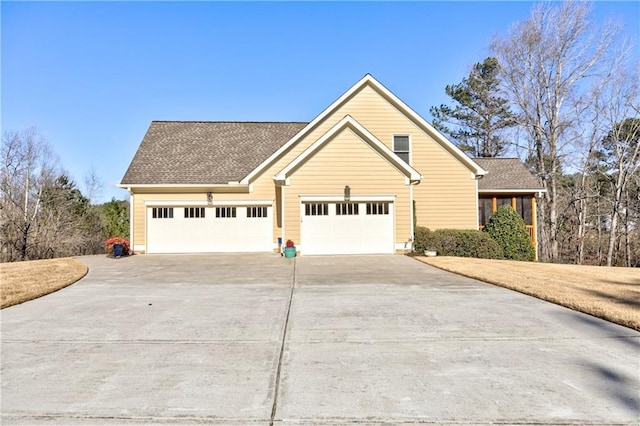 103 Old Avery Dr, Canton, GA 30115 - view of front of house featuring concrete driveway, a garage, and roof with shingles