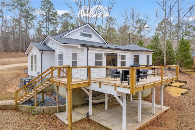 back of house with a patio and a deck