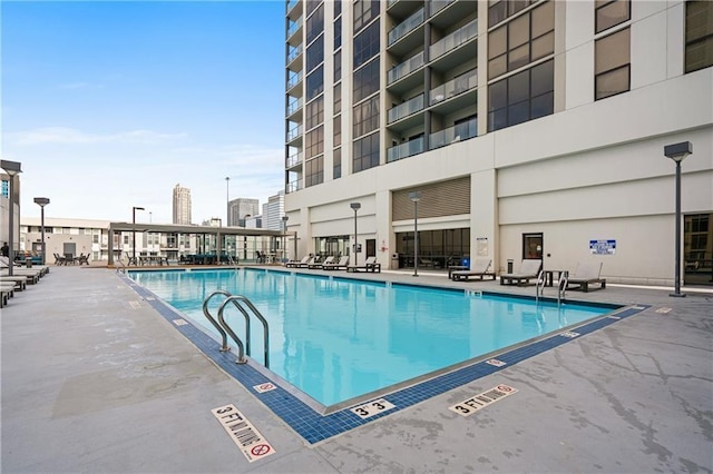 view of swimming pool with a patio