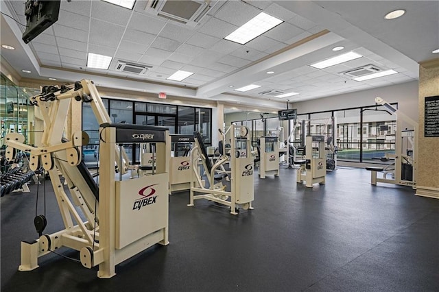 workout area with a paneled ceiling