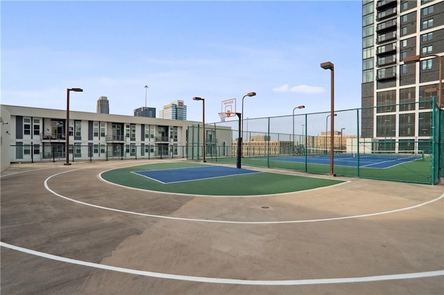 view of sport court featuring tennis court