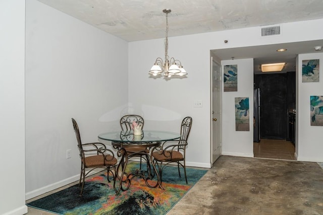 dining area with a notable chandelier