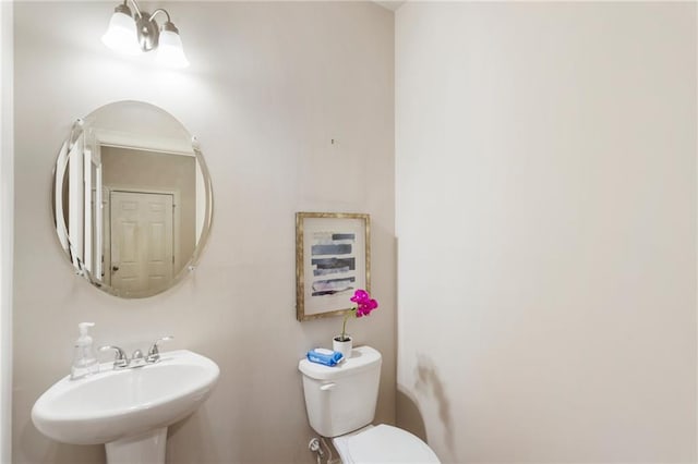 bathroom featuring sink and toilet