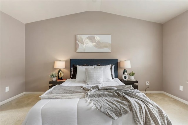 bedroom featuring light colored carpet and lofted ceiling