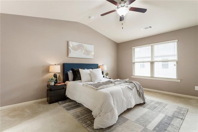 bedroom with ceiling fan, light carpet, and lofted ceiling