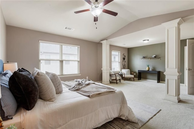 carpeted bedroom featuring vaulted ceiling, ceiling fan, and ornate columns