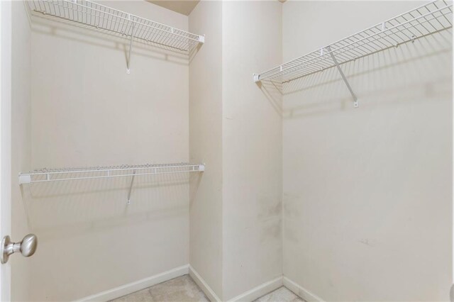 carpeted bedroom featuring connected bathroom, ceiling fan, and lofted ceiling