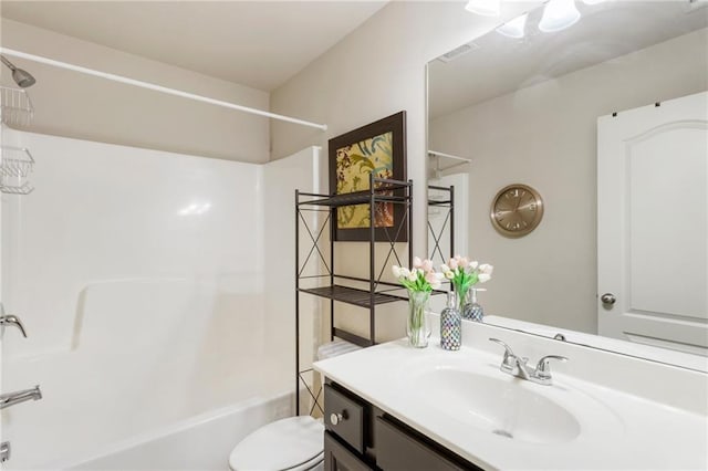 full bathroom featuring vanity, toilet, and shower / bath combination