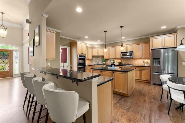 kitchen with crown molding, dark wood-style flooring, a kitchen island, tasteful backsplash, and appliances with stainless steel finishes
