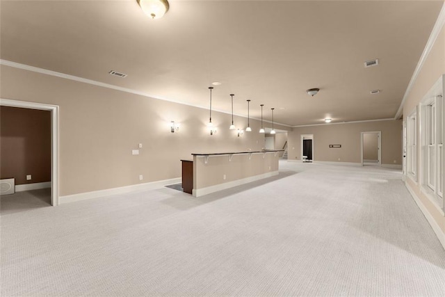unfurnished living room featuring crown molding, baseboards, and light colored carpet
