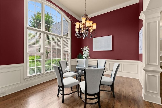 dining space with ornate columns, ornamental molding, and a wealth of natural light