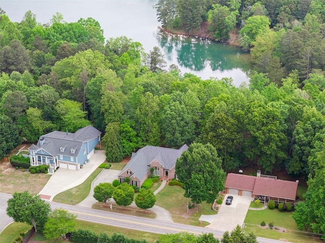 bird's eye view with a water view and a forest view