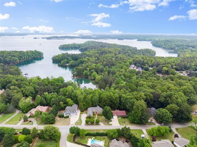 aerial view featuring a water view and a forest view