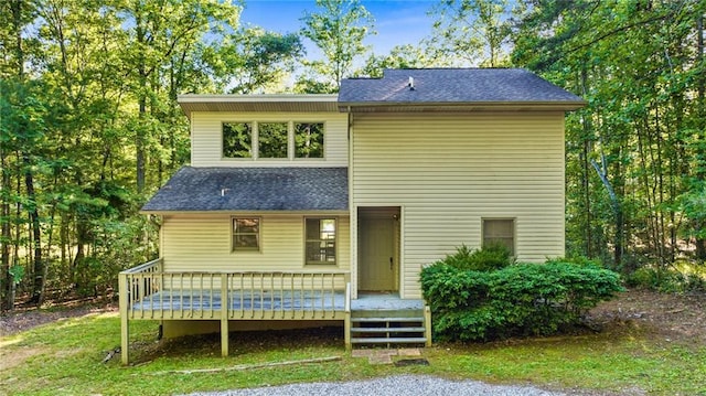 rear view of property with a deck