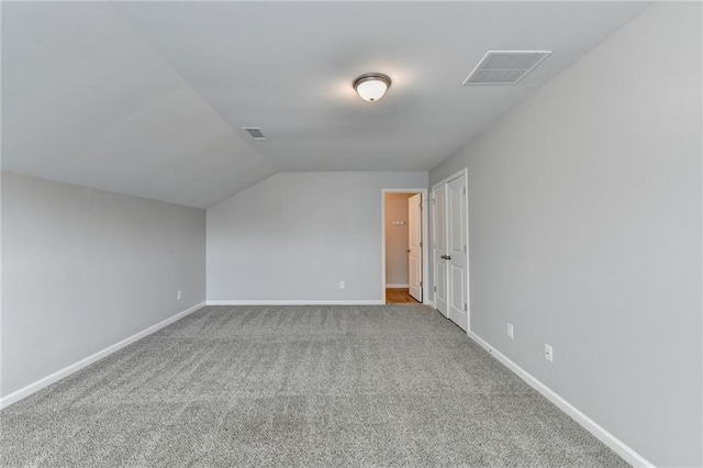 bonus room with carpet and lofted ceiling