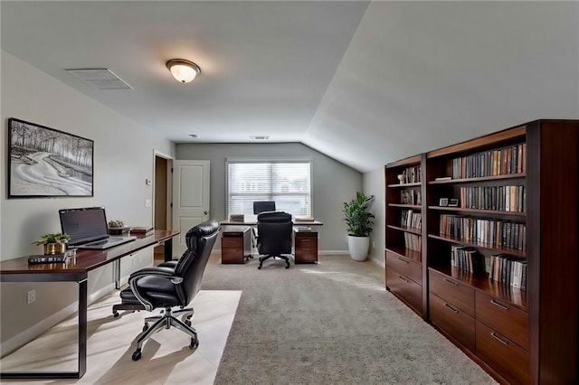 office featuring light carpet and vaulted ceiling