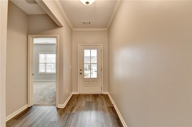 doorway featuring crown molding and hardwood / wood-style flooring