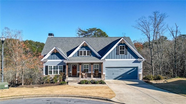 craftsman-style home featuring covered porch and a garage