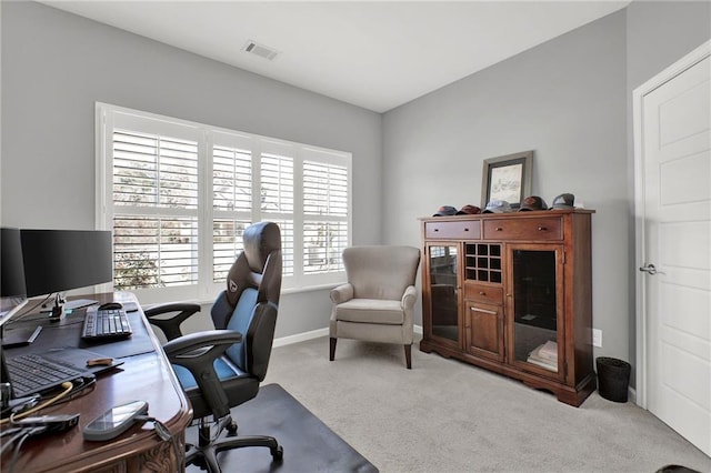 home office featuring light colored carpet