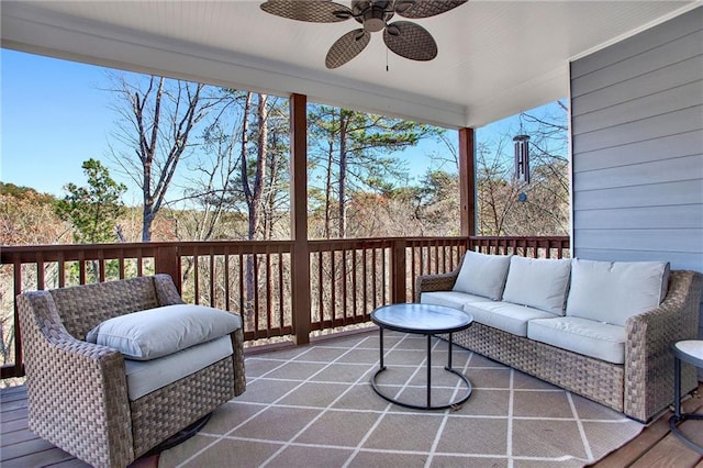 deck featuring ceiling fan and an outdoor hangout area