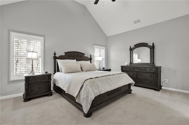 bedroom with light carpet, high vaulted ceiling, and ceiling fan