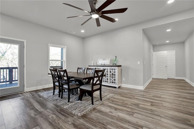 dining area featuring ceiling fan and hardwood / wood-style floors