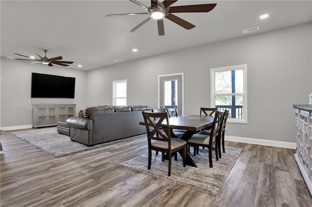 dining room featuring ceiling fan and hardwood / wood-style floors