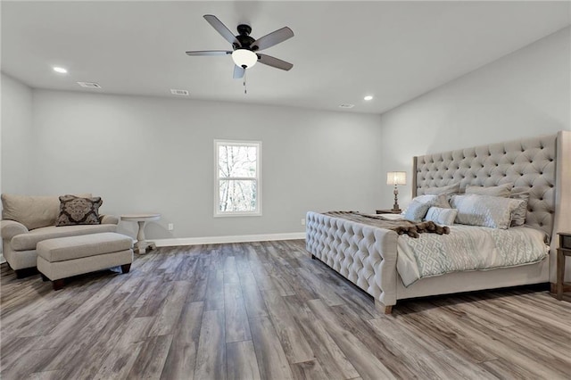 bedroom with wood-type flooring and ceiling fan