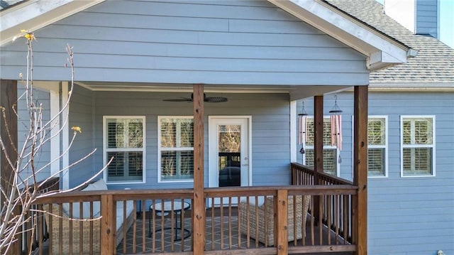 wooden deck featuring ceiling fan