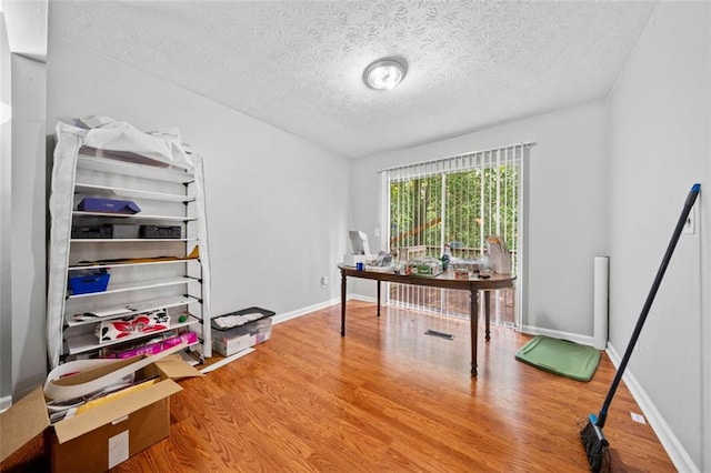 1991 Flat Shoals Rd, Riverdale, GA 30296 - home office with wood finished floors and a textured ceiling