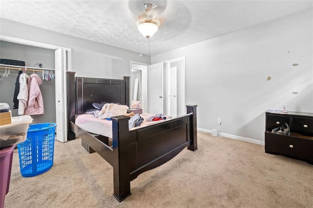 1991 Flat Shoals Rd, Riverdale, GA 30296 - carpeted bedroom with a closet, a textured ceiling, and ceiling fan
