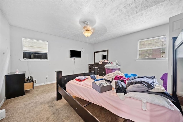 1991 Flat Shoals Rd, Riverdale, GA 30296 - carpeted bedroom featuring cooling unit, a textured ceiling, and a ceiling fan