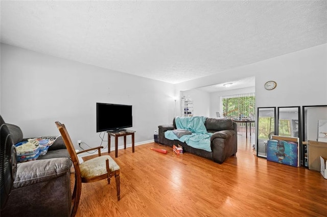 1991 Flat Shoals Rd, Riverdale, GA 30296 - living area with wood finished floors and a textured ceiling