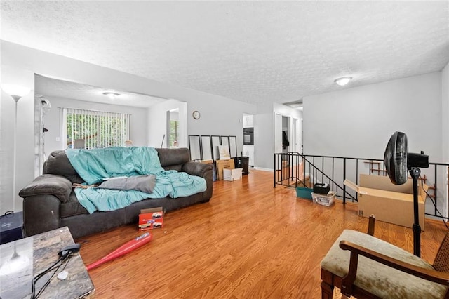 1991 Flat Shoals Rd, Riverdale, GA 30296 - living room with a textured ceiling and wood finished floors