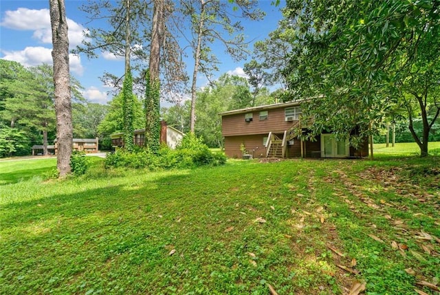1991 Flat Shoals Rd, Riverdale, GA 30296 - view of green lawn with stairway and a wooden deck