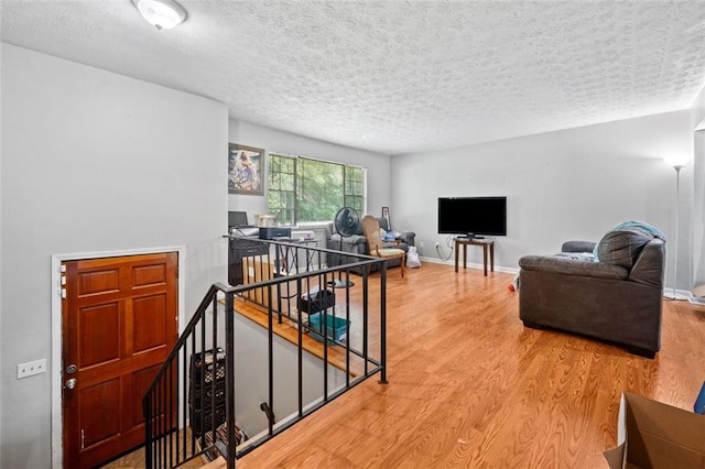 1991 Flat Shoals Rd, Riverdale, GA 30296 - living area featuring wood finished floors and a textured ceiling