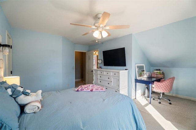 carpeted bedroom with vaulted ceiling and ceiling fan