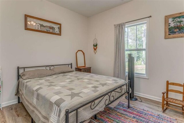 22 Gowen Dr, Rome, GA 30165 - bedroom featuring wood finished floors and baseboards