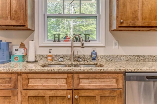22 Gowen Dr, Rome, GA 30165 - kitchen with stainless steel dishwasher, a sink, healthy amount of natural light, and light stone counters