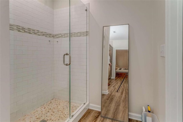 22 Gowen Dr, Rome, GA 30165 - bathroom featuring wood finished floors, a shower stall, and baseboards