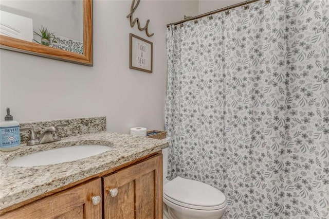 22 Gowen Dr, Rome, GA 30165 - bathroom featuring vanity, toilet, and curtained shower