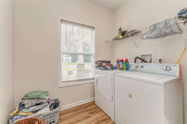 22 Gowen Dr, Rome, GA 30165 - laundry area featuring washer and clothes dryer, healthy amount of natural light, baseboards, and light wood-type flooring