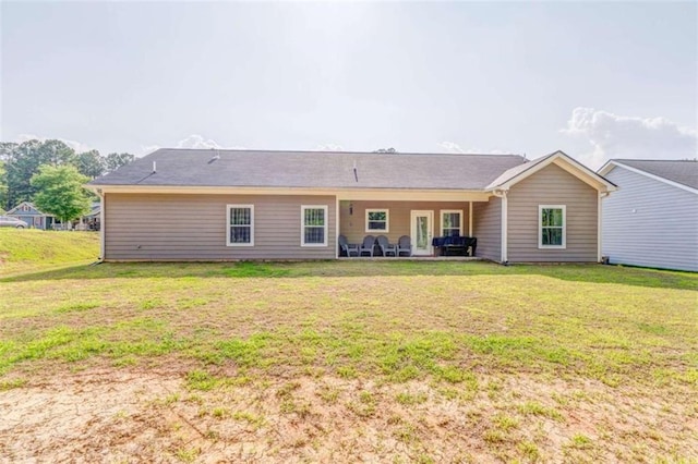 22 Gowen Dr, Rome, GA 30165 - rear view of property with a lawn and a patio area