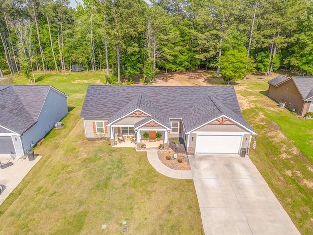 22 Gowen Dr, Rome, GA 30165 - view of front of property with board and batten siding, an attached garage, driveway, a front yard, and roof with shingles