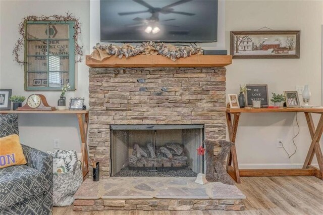 22 Gowen Dr, Rome, GA 30165 - detailed view of wood finished floors, a ceiling fan, a fireplace, and baseboards