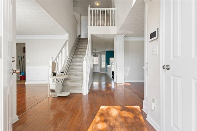 entryway featuring crown molding and hardwood / wood-style flooring